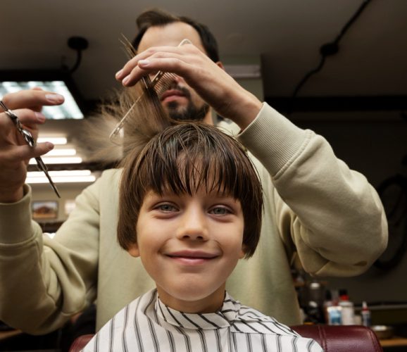 smiley-kid-getting-haircut-front-view